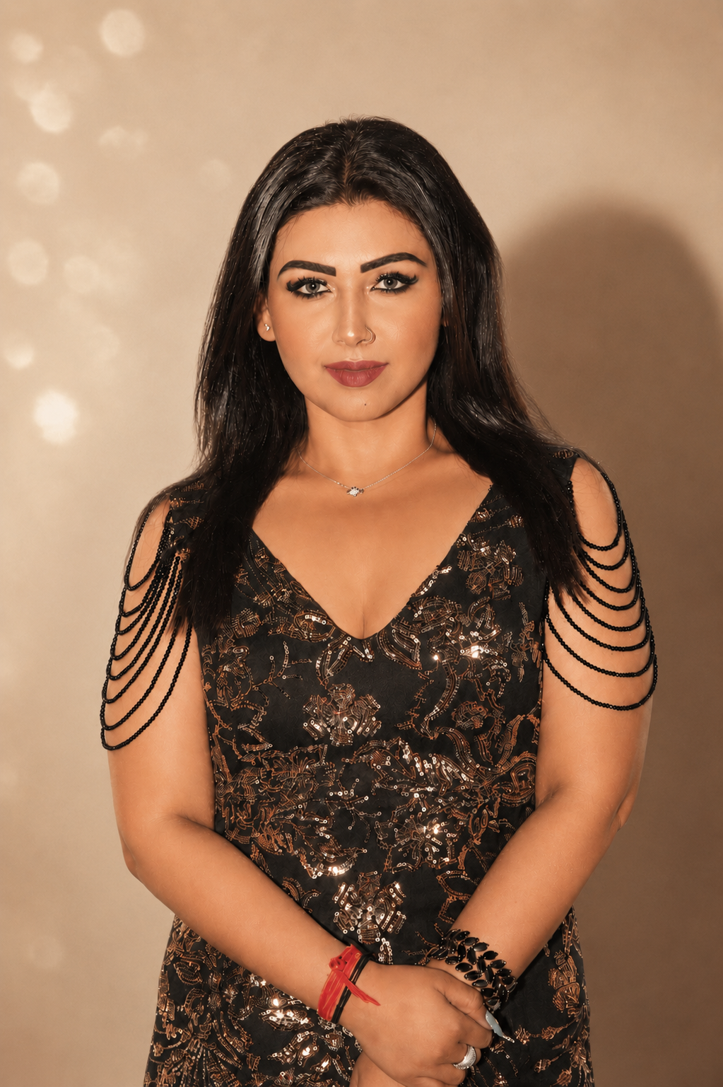 Trishla Pathak in an embellished gown under warm golden light